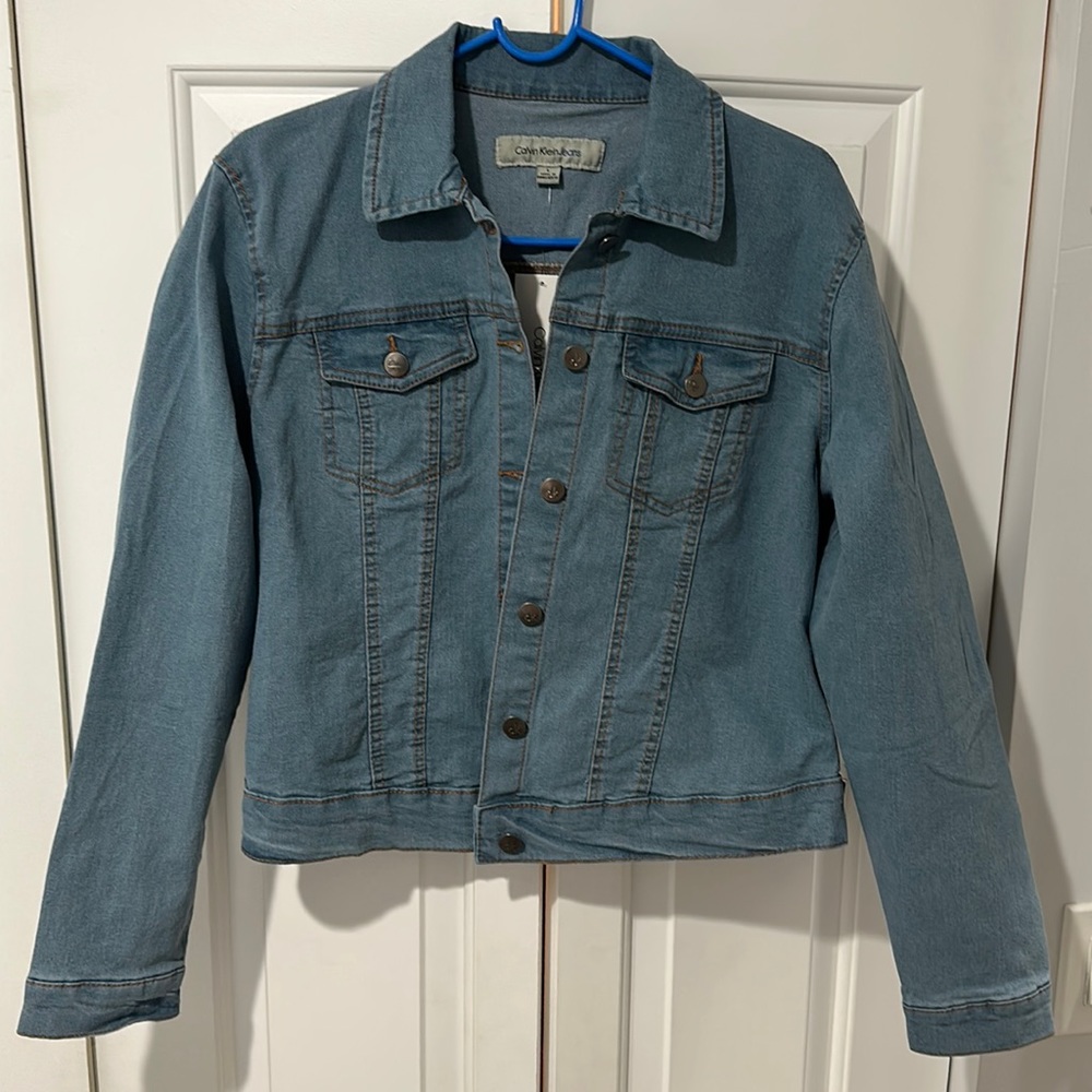 Calvin Klein Light Blue denim jacket. NWT. Never worn. Only tried on. Size Large